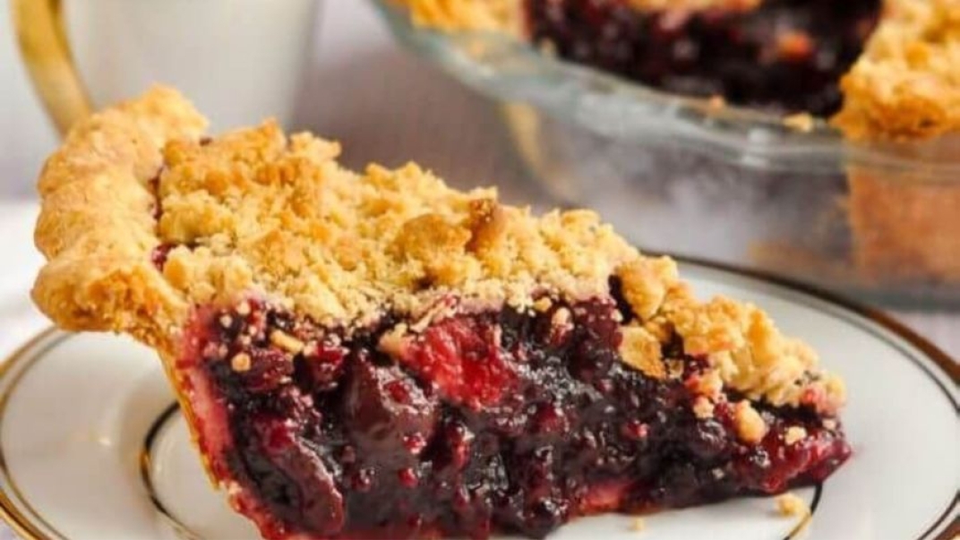 cherry pie on a plate with gold detailing