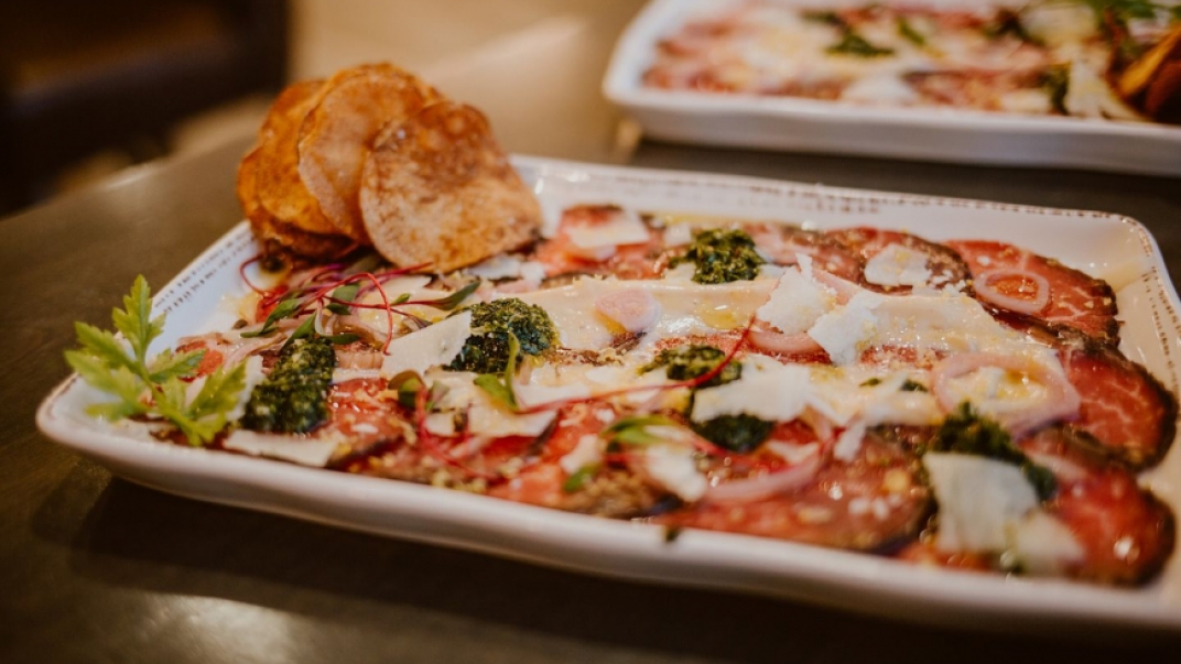 plate of appetizers with meat and cheese
