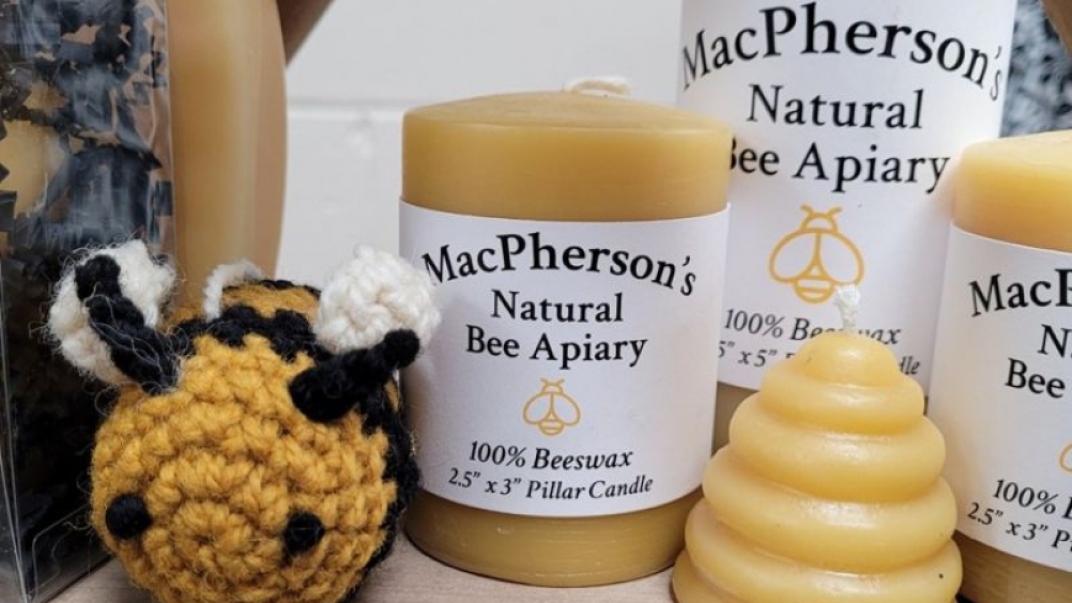 Beeswax crafts including candles and a crochet bee