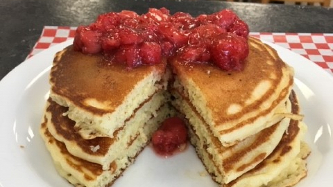 stack of pancakes with berries on top