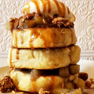 stack of extra thick pancakes with various toppings 