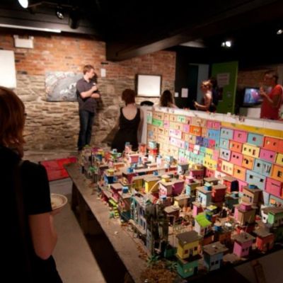 people around various art exhibits