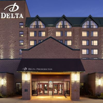 Delta Fredericton at night with welcoming lighting. 