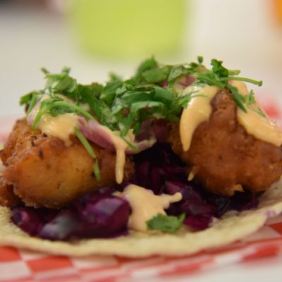 open face taco on checkered parchment paper