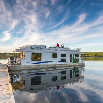Docked houseboat by a lake