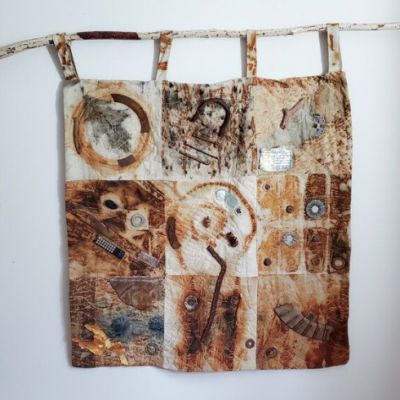 quilted art hung on the wall