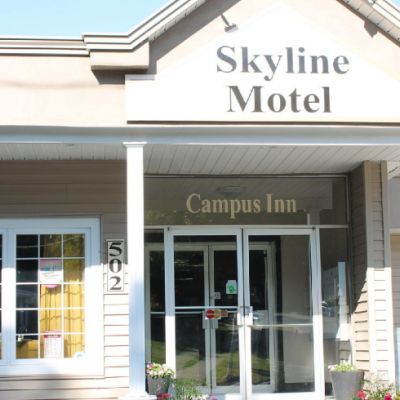 skyline motel building and a blue sky