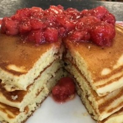 stack of pancakes with berries on top
