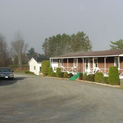 town and country motel with brown siding