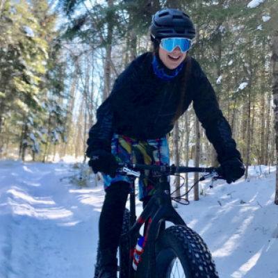 girl riding a fat bike in winter