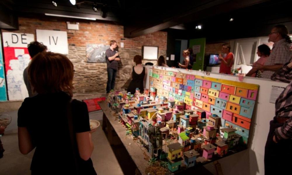people around various art exhibits