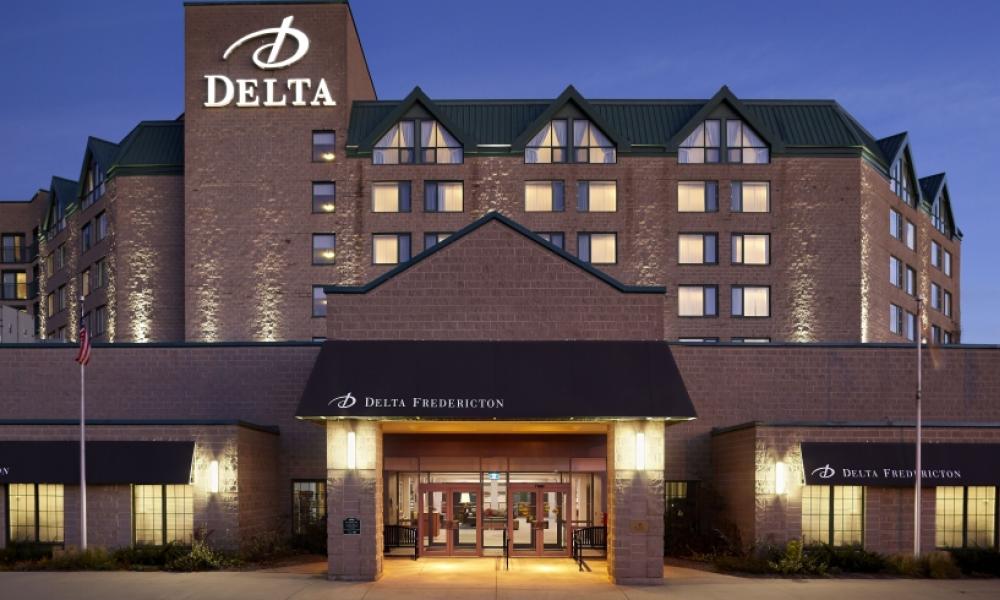 Delta Fredericton at night with welcoming lighting. 
