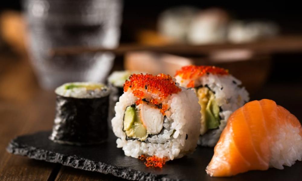 different sushi rolls on a tray