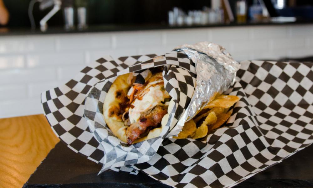Donair in paper wrap on a table