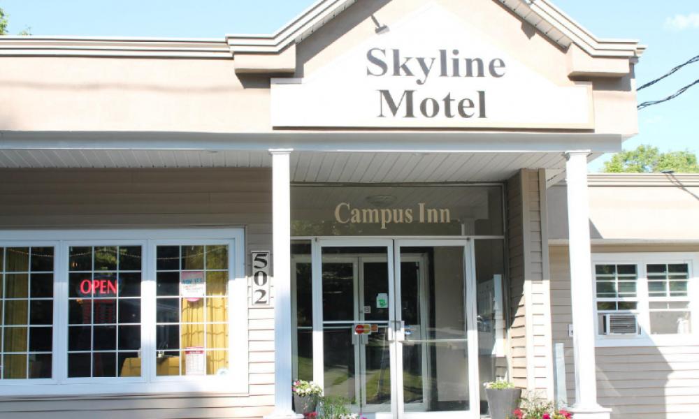 skyline motel building and a blue sky