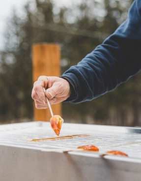 man preparing maple candy